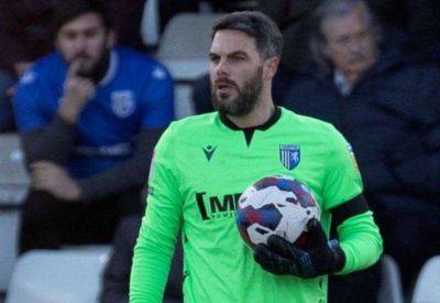 Gillingham goalkeeper Glenn Morris reacts to their defeat against AFC Wimbledon on Tuesday night and play-off hopes in League 2