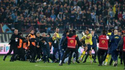 Trabzonspor fans storm pitch, charge players after loss - ESPN - espn.com - Belgium - Brazil - Turkey - Macedonia