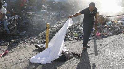 Bodies pile up as gangs rampage through Haiti's capital - euronews.com - Usa - Haiti - county Wake