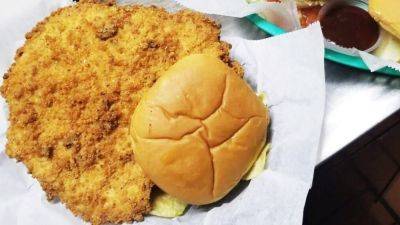 Hoops hero who inspired 'Hoosiers' now serves legendarily large Indiana-style fried pork sandwiches