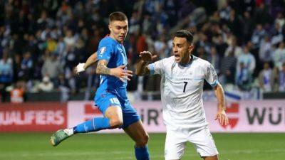 Anthony Taylor - Gudmundsson hat-trick earns Iceland 4-1 win over Israel - channelnewsasia.com - Ukraine - Germany - Belgium - Romania - Iceland - Israel - Slovakia
