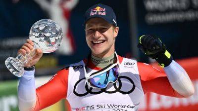 Odermatt seals World Cup super-G title as teammate Rogentin leads Swiss sweep of podium