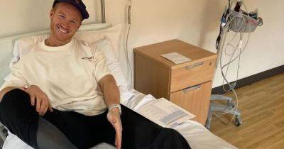 Dancing on Ice star Greg Rutherford shares update from hospital bed after 'giving himself a C-section'