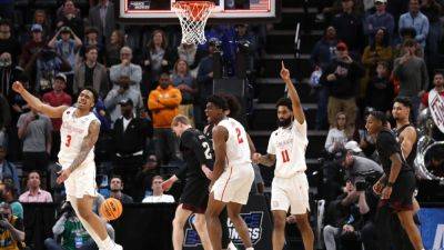 James Madison - Houston outlasts Texas A&M in OT, advances in NCAA tournament - ESPN - espn.com - state Tennessee - state Texas - county Dallas