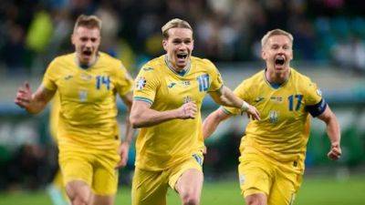 Vladimir Putin - Oleksandr Zinchenko - International - Ukraine qualifies for Euro 2024 after securing late comeback victory over Iceland - cbc.ca - Russia - Ukraine - Germany - Georgia - Poland - Iceland