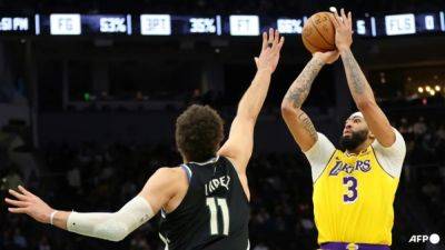 Anthony Davis - Austin Reaves - Darvin Ham - Davis leads Lakers comeback over Bucks in overtime thriller - channelnewsasia.com - county Bucks - Los Angeles - county Davis