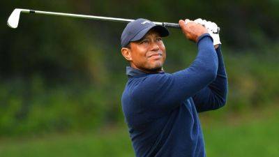 Five-time Masters champ Tiger Woods touches down in Augusta - ESPN