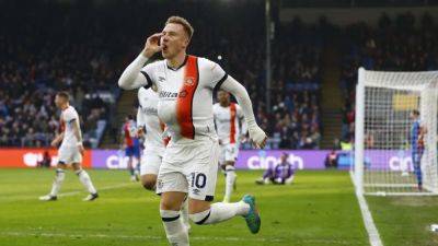Woodrow late show salvages draw for Luton at Palace