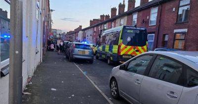 Riot van and huge police presence descend after men 'fight with knives'