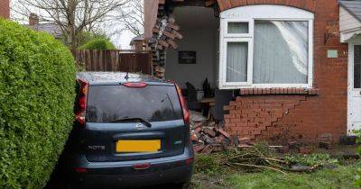 Bricks collapse and residents evacuated after car smashes into Greater Manchester home