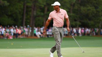 Tiger Woods 1 under at Masters but faces 23-hole test Friday - ESPN