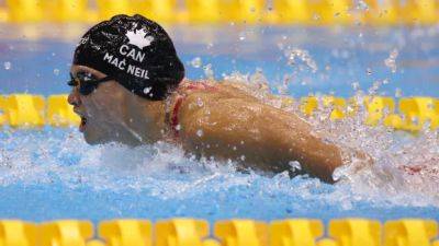 Mac Neil narrowly edged by McIntosh in 100m fly at Canadian Swimming Open, has no plans for retirement