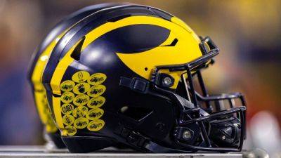 Jim Harbaugh - Michigan reaches settlement with NCAA for recruiting violations - ESPN - espn.com - Los Angeles - state Michigan
