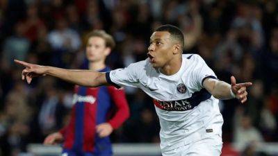 Mbappe scores twice as PSG beat 10-man Barca to reach semi-finals