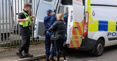 Two arrests as police swoop on homes and business after 40-officer operation - manchestereveningnews.co.uk