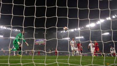 Paulo Dybala - Gianluca Mancini - Rafael Leao - Bayer Leverkusen - Ten-man Roma beat Milan to set up Europa League semi-final with Leverkusen - channelnewsasia.com