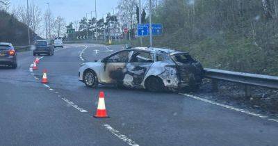 Burnt out car left on M60 slip road after bursting into flames