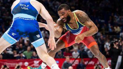 Olympic medalist Jordan Burroughs gets into verbal confrontation with unruly fan after heartbreak at US trials