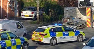 Two police officers injured after van 'rams' GMP car then overturns - manchestereveningnews.co.uk
