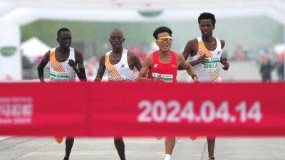 Beijing half marathon organisers strip top three of medals - channelnewsasia.com - China - Ethiopia