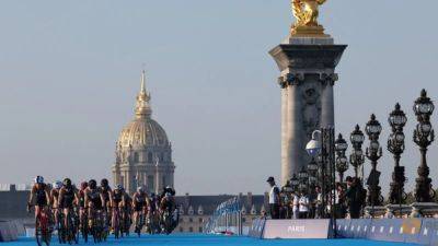 Emmanuel Macron - Anne Hidalgo - Paris Games - 'Just put me in there': Aussie triathlete shrugs off Seine concerns - channelnewsasia.com - France - Australia