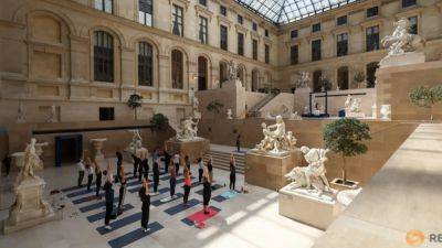 Parisians warm up for Olympics with workouts in Louvre museum