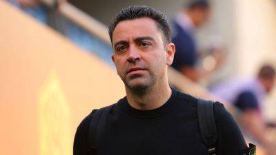 Xavi agrees to remain Barcelona coach in dramatic U-turn - source - ESPN