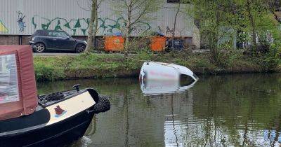 Van still floating in Bridgewater Canal more than TWO MONTHS after first going into the water