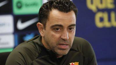 Xavi says Barca project behind decision to stay, not money