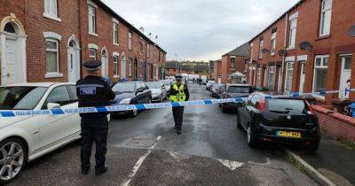 LIVE: Police 'swarm' Oldham road with cordon in place - updates
