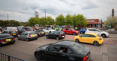 Huge police presence at retail park after hundreds gather for 'illegal car meet' - manchestereveningnews.co.uk - county Denton - county Park