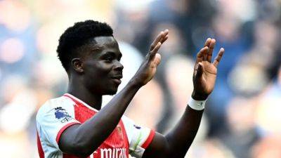 Saka shares relief as Arsenal hold off Spurs fightback