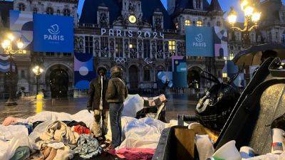 Paris police remove dozens of migrants from Paris City Hall 100 days before Olympic Games