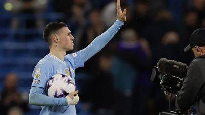 Phil Foden - Jeremy Doku - Foden hat-trick keeps Man City in thick of title race - channelnewsasia.com - county Morgan - county Rogers