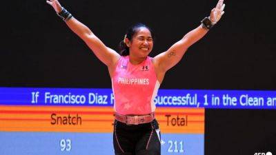 Philippines Olympics gold winner Diaz to keep lifting as Paris dream ends - channelnewsasia.com - China - Los Angeles - Thailand - Philippines