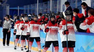 Zhan outstanding as China beats Japan in shootout at women's hockey world championship