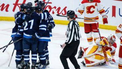 Tyler Toffoli - Connor Hellebuyck - Kyle Connor - Jonathan Huberdeau - Gabe Vilardi hat trick helps Winnipeg Jets clinch playoff spot with 5-2 win over Calgary - cbc.ca - Canada - county Centre