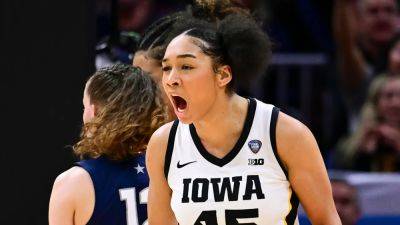 Iowa survives UConn's late-game push to reach NCAA title game