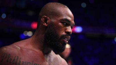 UFC star Jon Jones denies threatening testing agent at his home - ESPN