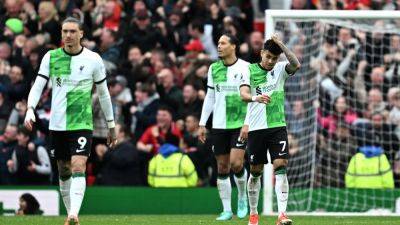 Liverpool title hopes dented in chaotic Manchester United draw