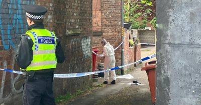 LIVE updates as police cordon off alleyway with girl, 16, in critical condition