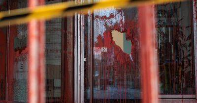 Woman arrested after Palestine protesters smash glass and throw red paint at offices