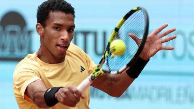 Auger-Aliassime into Madrid Open semis without playing after Sinner exits with hip injury