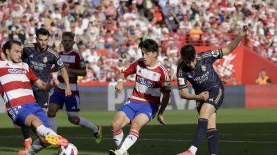 Ruthless Real Madrid celebrate league title with crushing win over relegated Granada