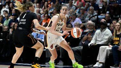 Caitlin Clark - Caitlin Clark era begins with loss as star rookie scores 20 in highly anticipated WNBA debut - cbc.ca - state Indiana - state Connecticut