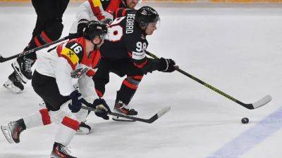 John Tavares - Connor Bedard - Tavares scores in OT, rescues Canada after it blows 6-1 lead to Austria at hockey worlds - cbc.ca - Switzerland - Canada - Austria - Jordan