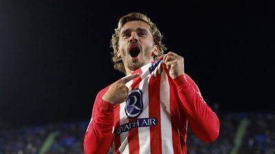 Griezmann hat-trick downs Getafe as Atletico Madrid seal Champions League spot