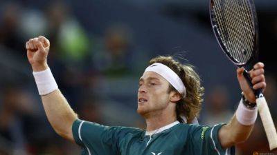 Fiery Rublev keeps a cool head to move on in Madrid