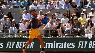 Alcaraz banishes injury fears to reach second round at French Open