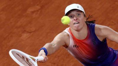 Swiatek survives almighty scare to pip Osaka in French Open thriller